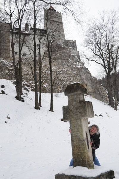 Hiding behind the headstone at Dracula's Castle